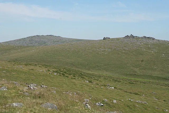 Two hut circles near the Ordnance Survey triangulation pillar on Cox Tor