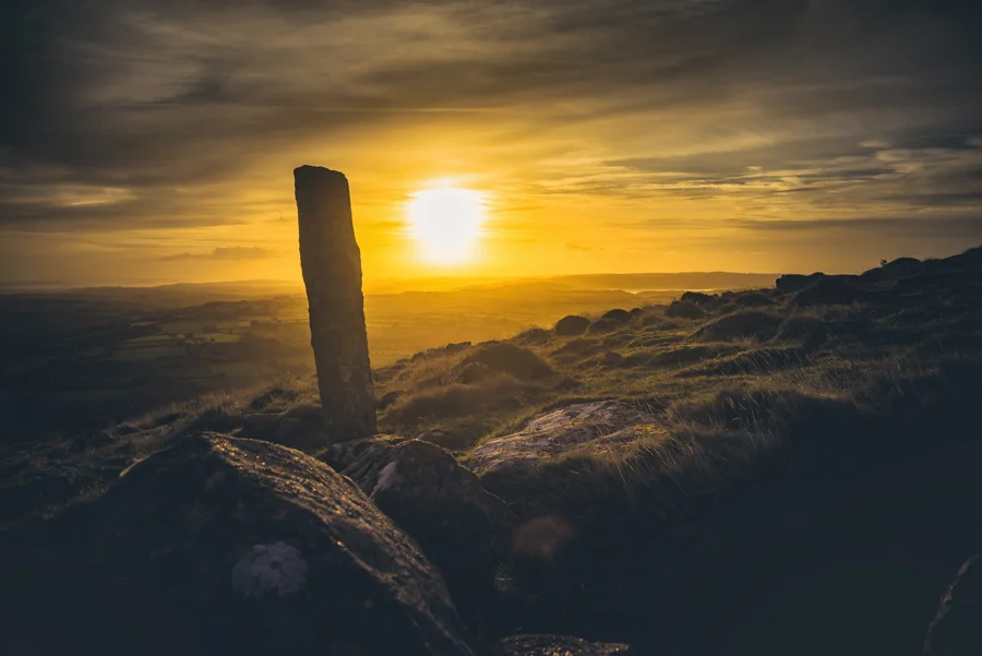 Sunset behind the standing stone at Foxes' Holt, Cosdon Hill